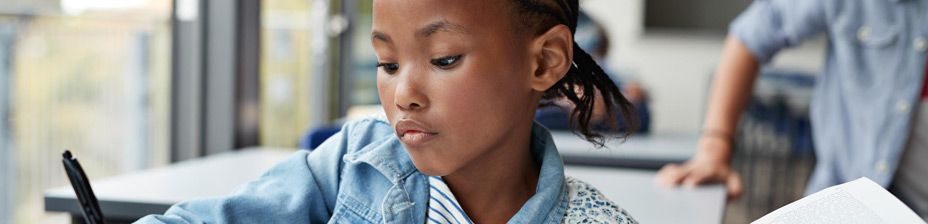 girl-at-school-writing-header-image-theme-page